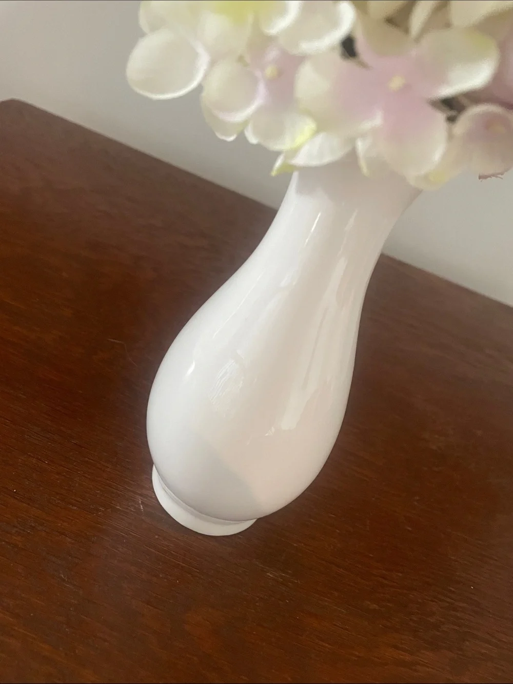 White 6 inch vase with light color flowers